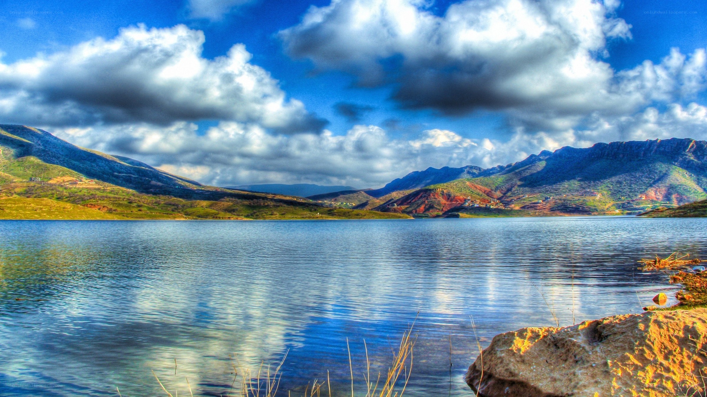 Mountain lake under cloudy sky