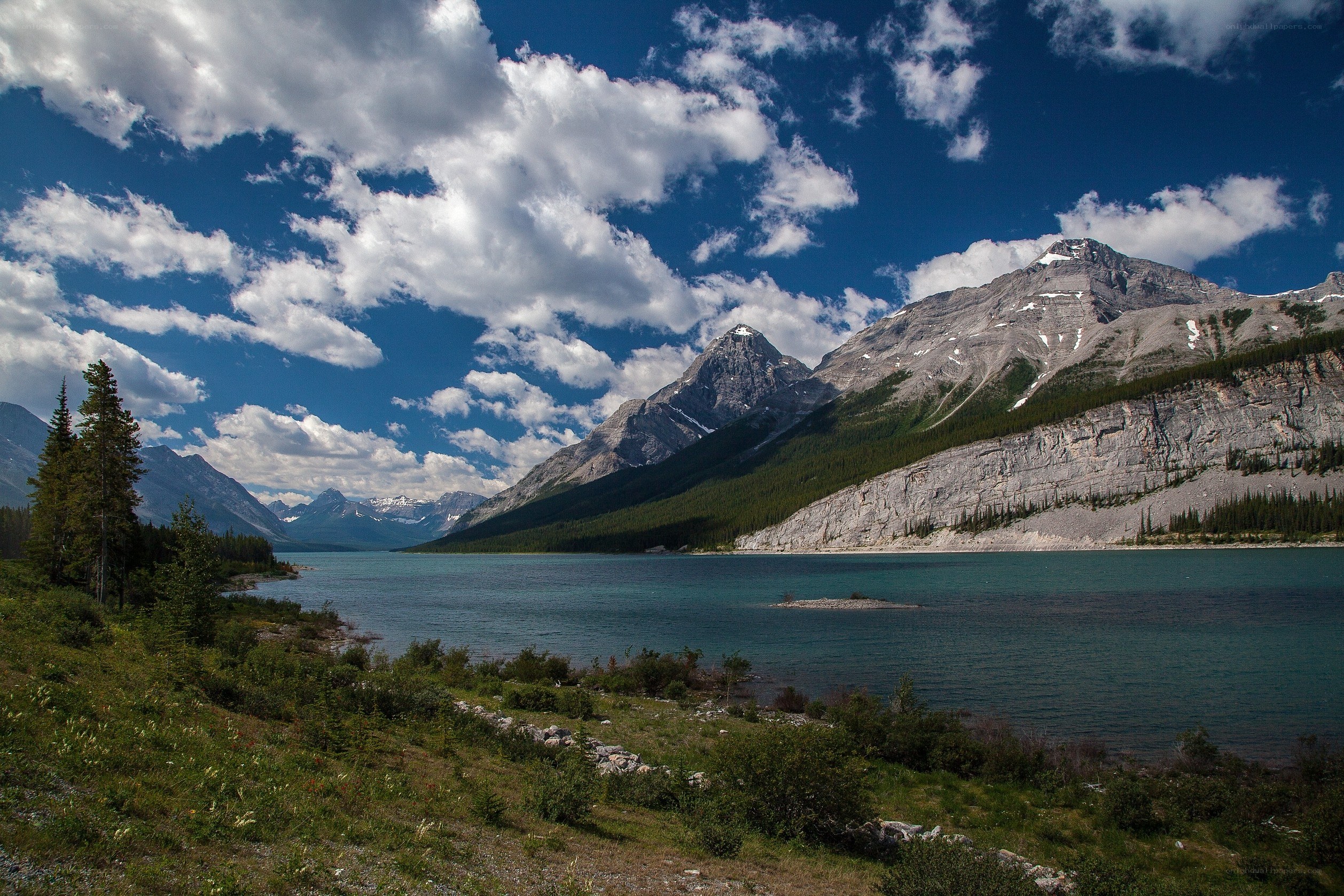 Mountain lake under cloudy sky