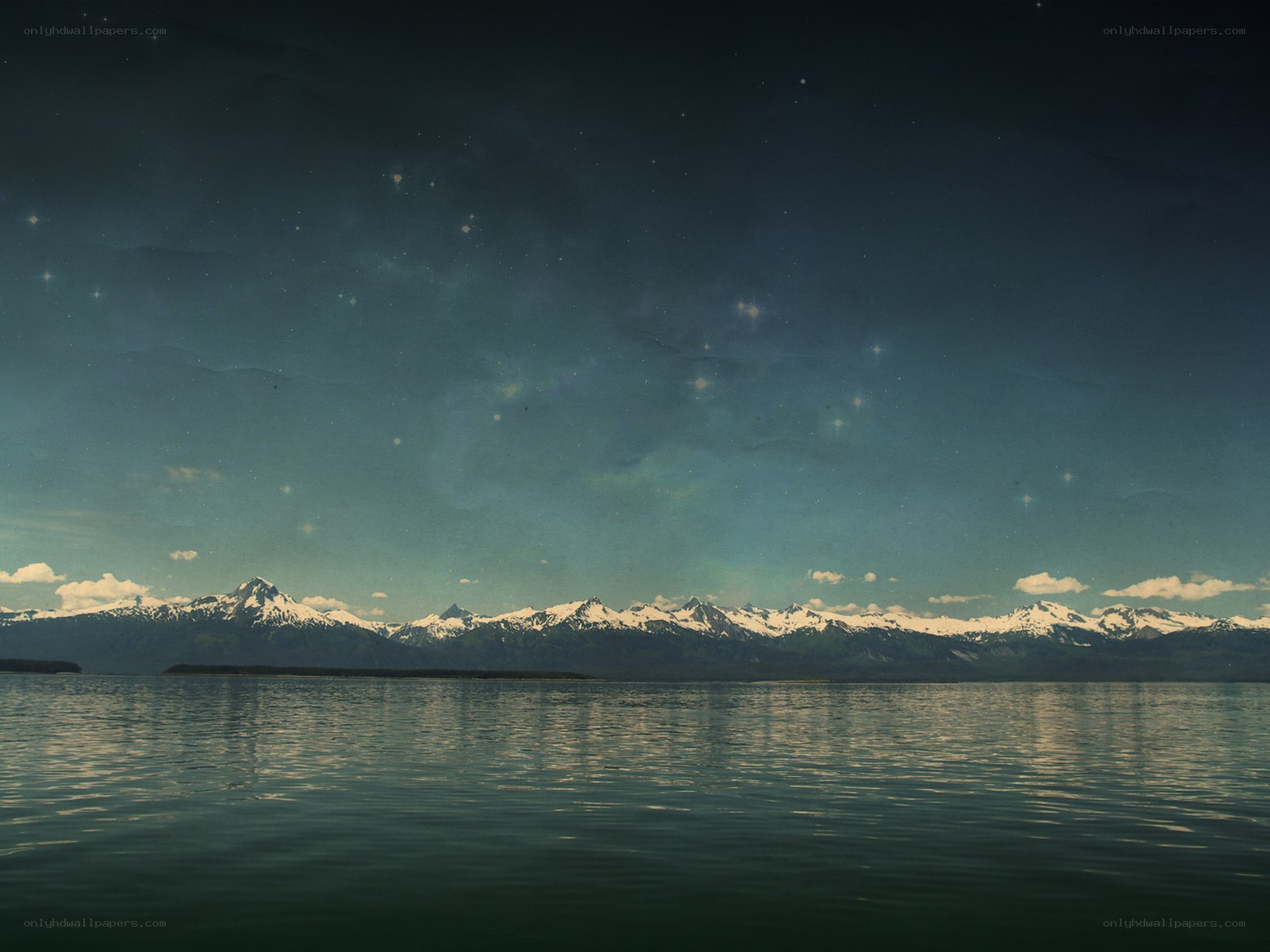 Mountain lake under starry sky