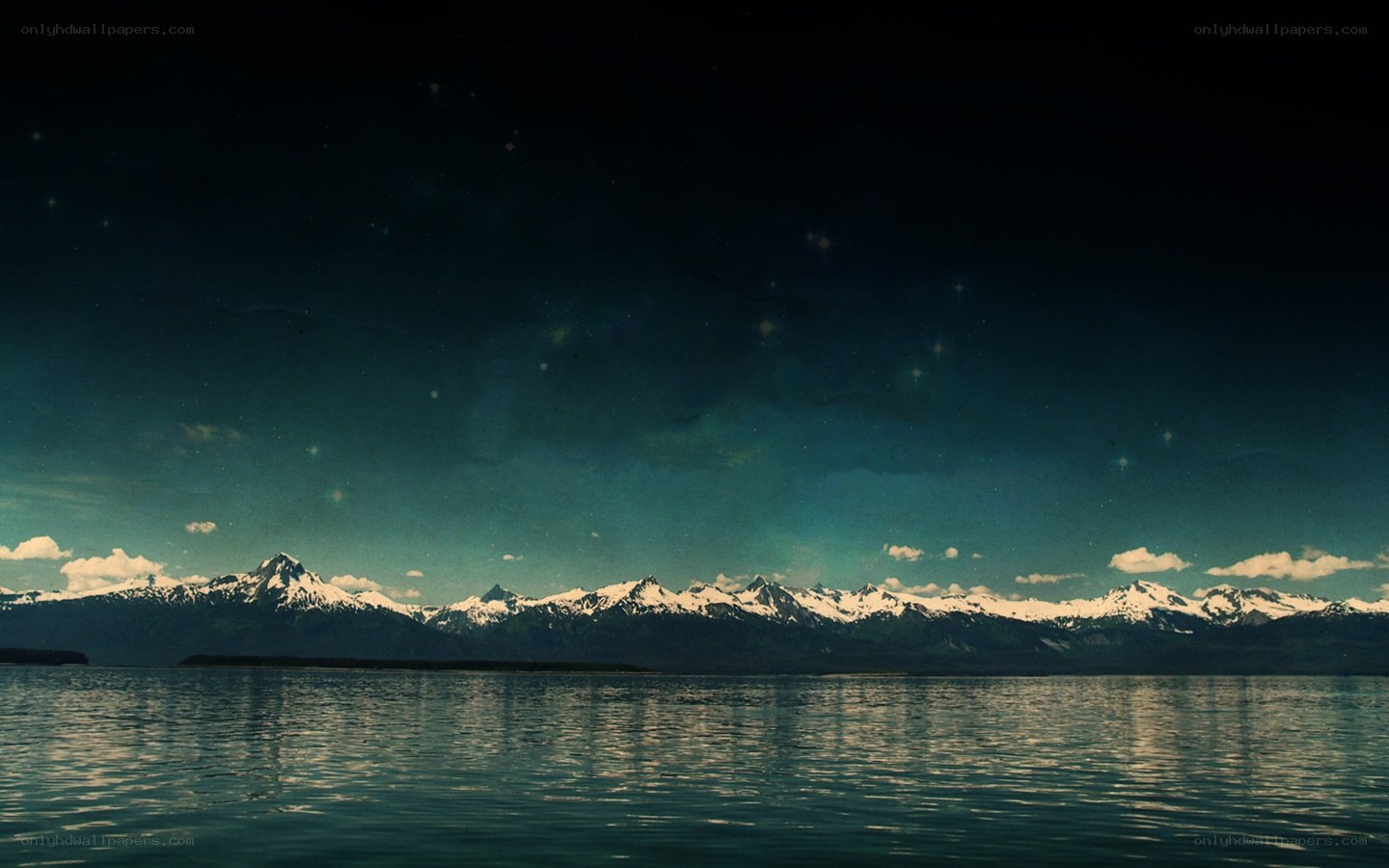 Mountain lake under starry sky