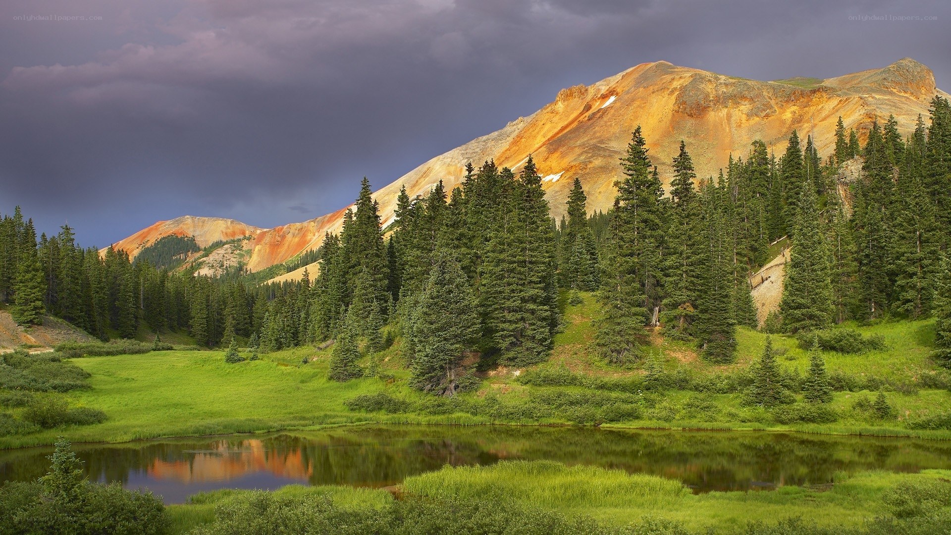 Mountain lake under stormy sky