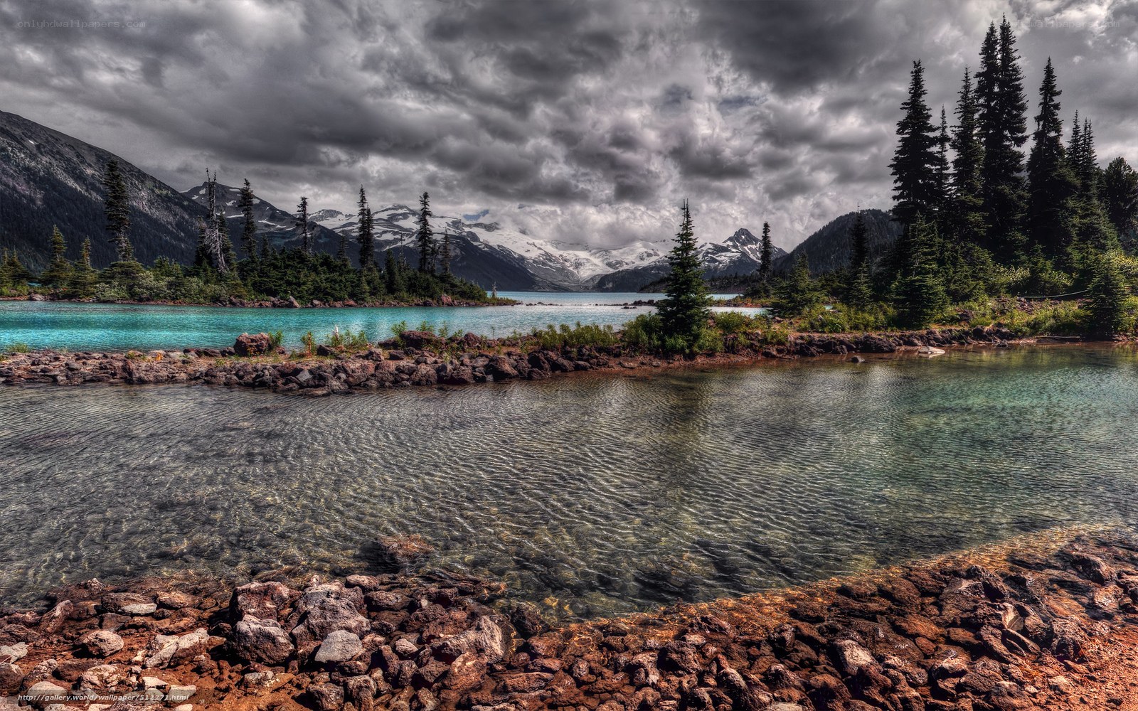 Mountain lake under stormy sky