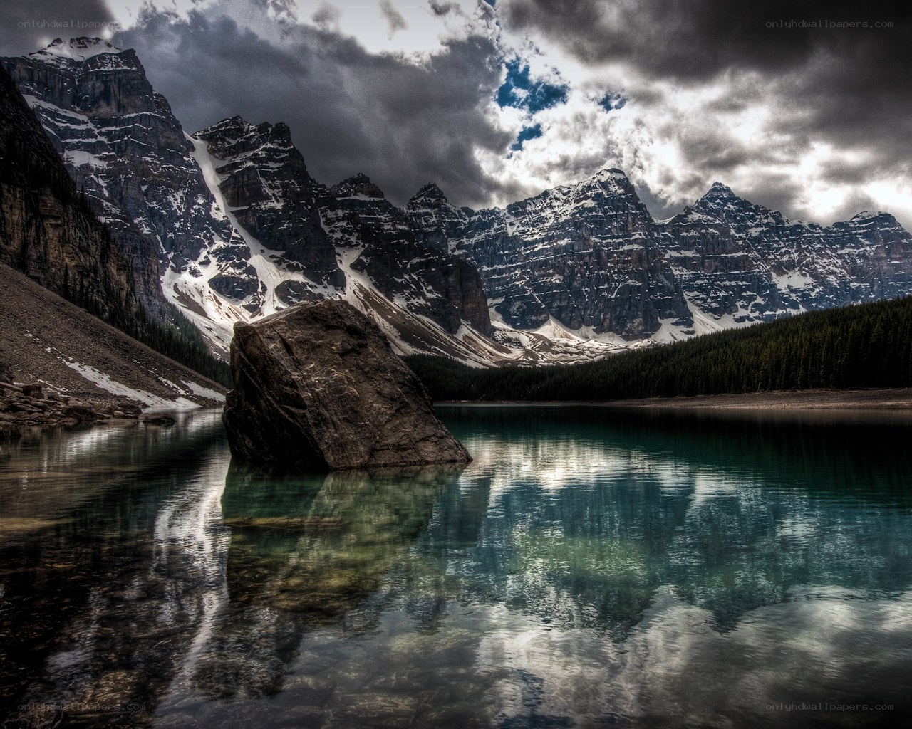 Mountain lake under stormy sky