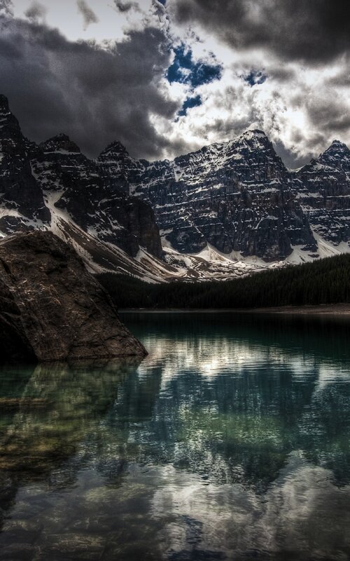 Mountain lake under stormy sky