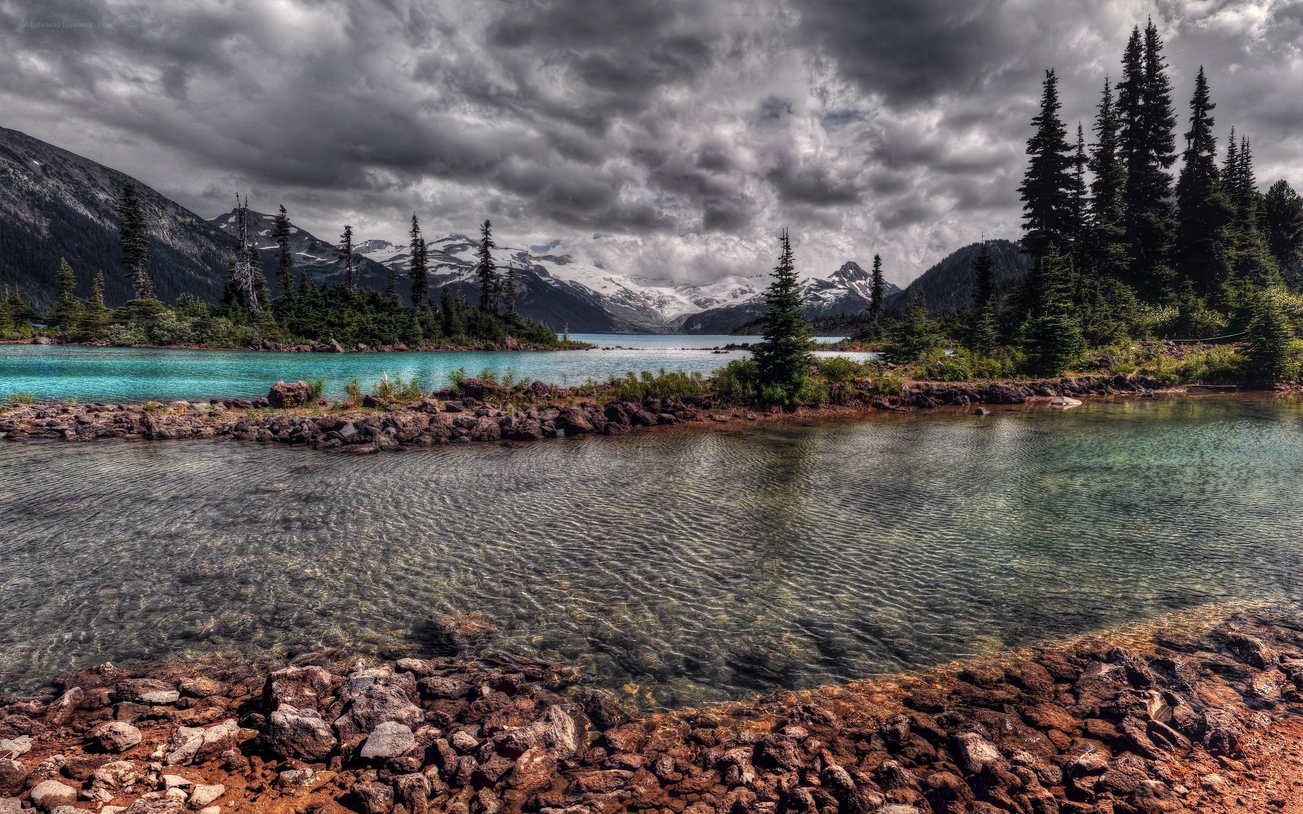 Mountain lake under stormy sky