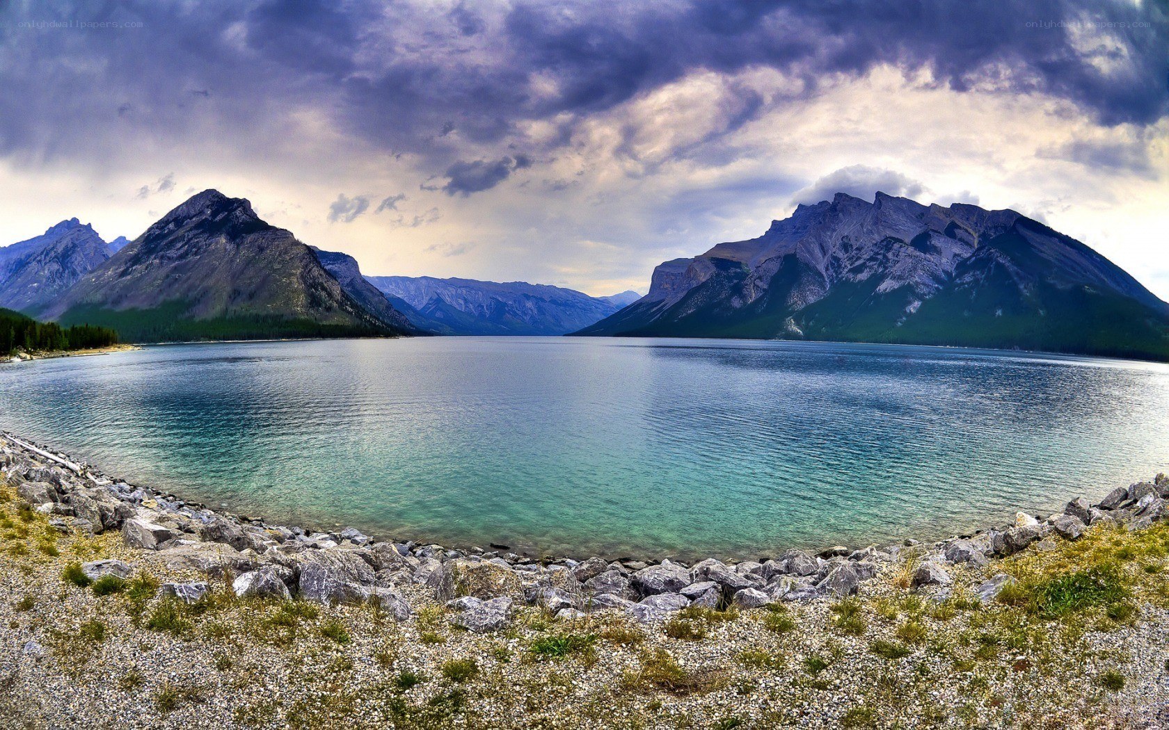 Mountain lake under stormy sky