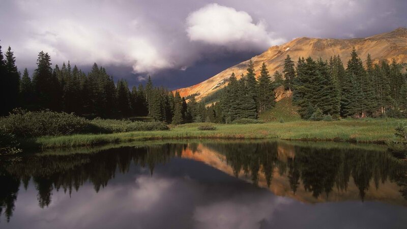 Mountain lake under stormy sky