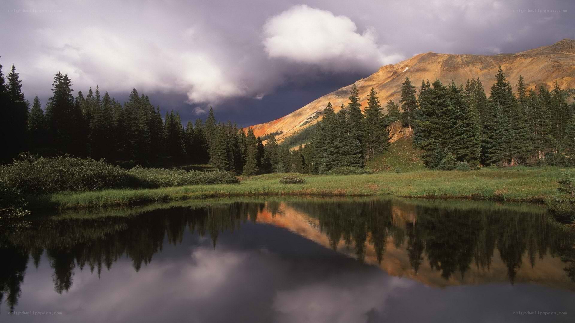 Mountain lake under stormy sky