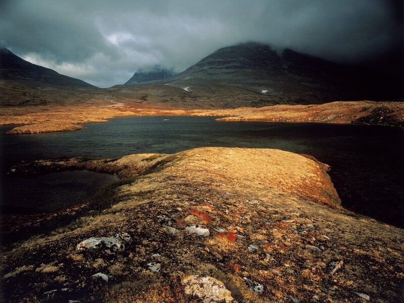 Mountain lake under stormy sky