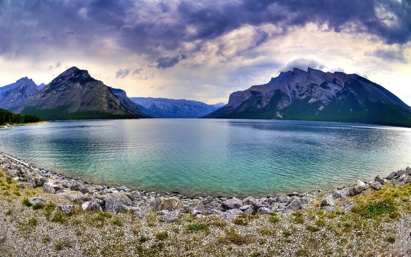 Mountain lake under stormy sky