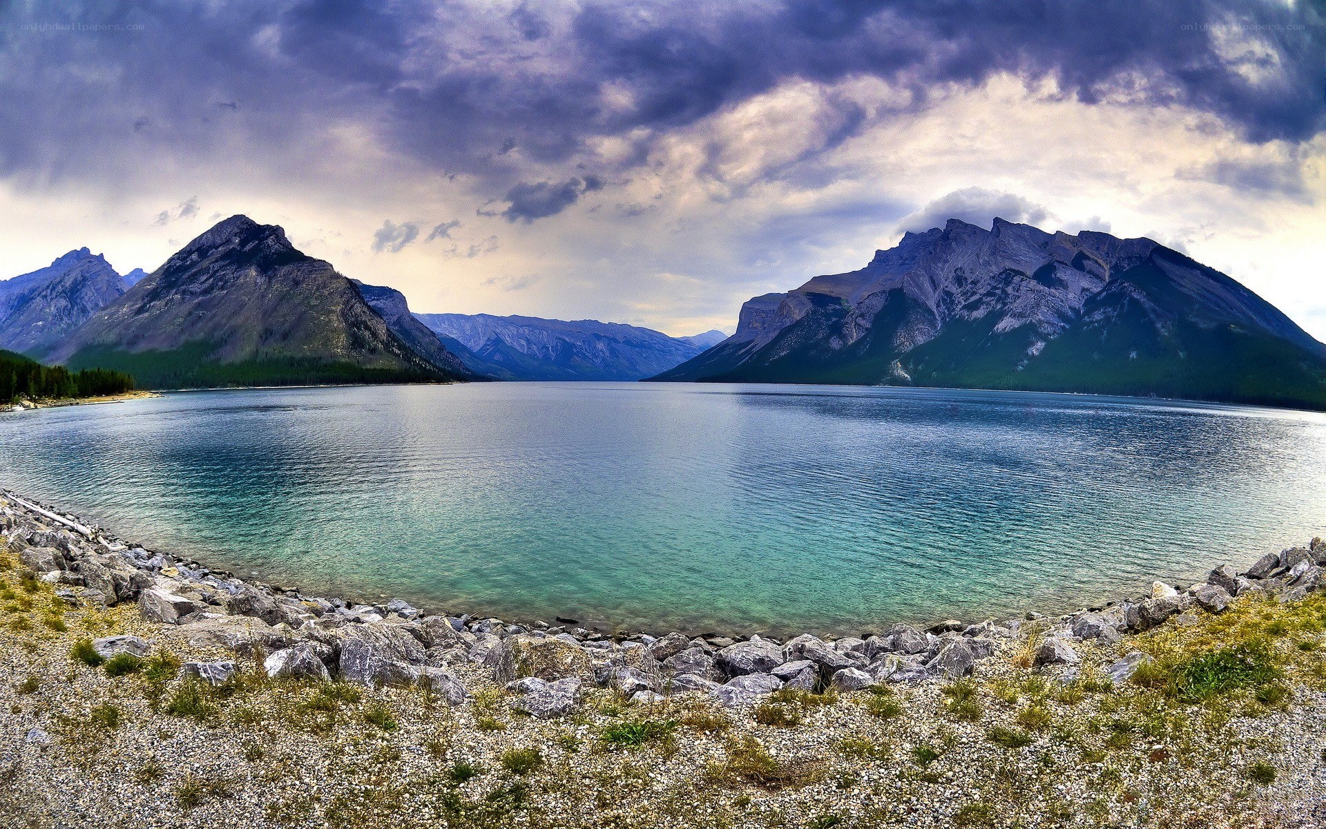 Mountain lake under stormy sky