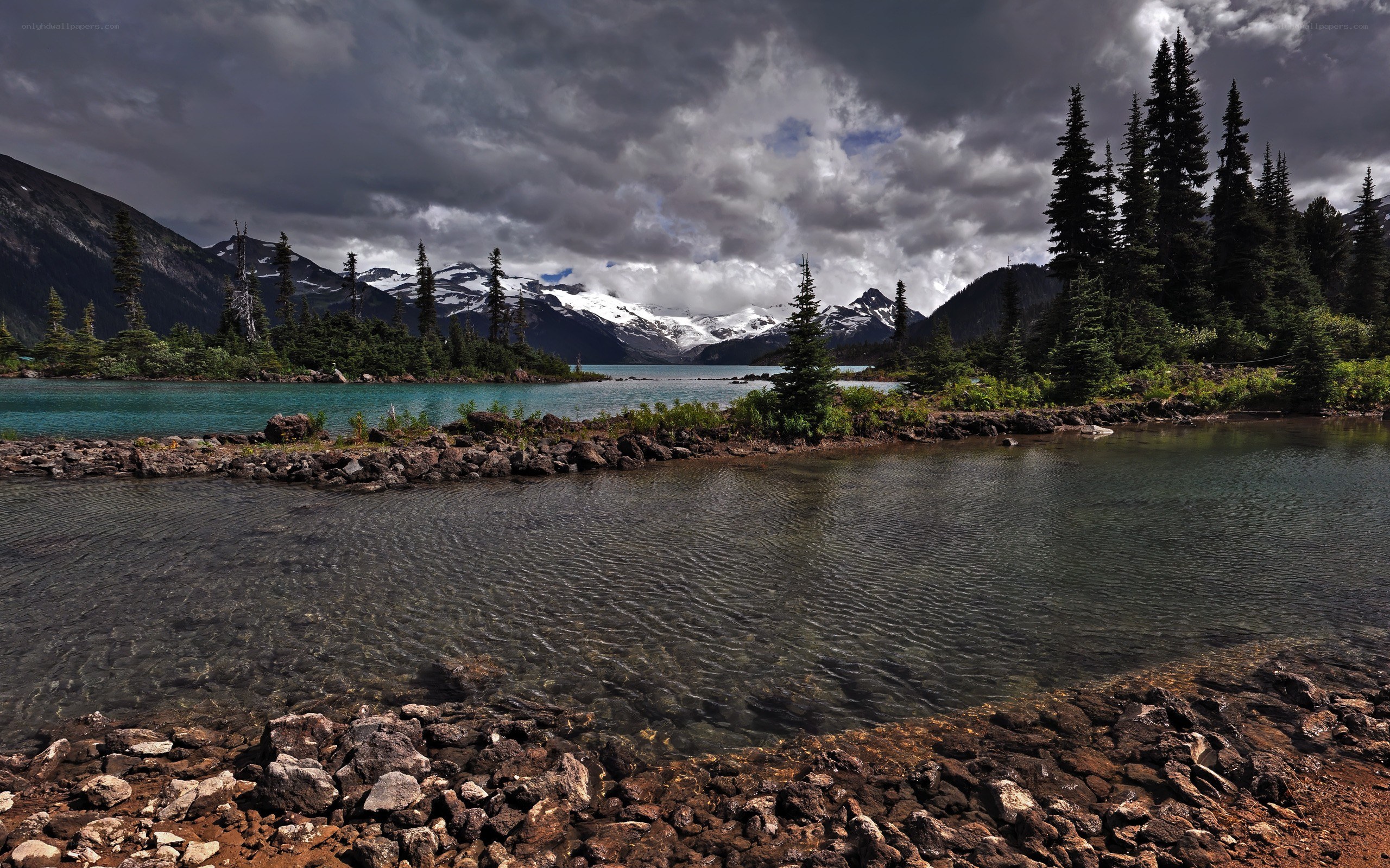 Mountain lake under stormy sky