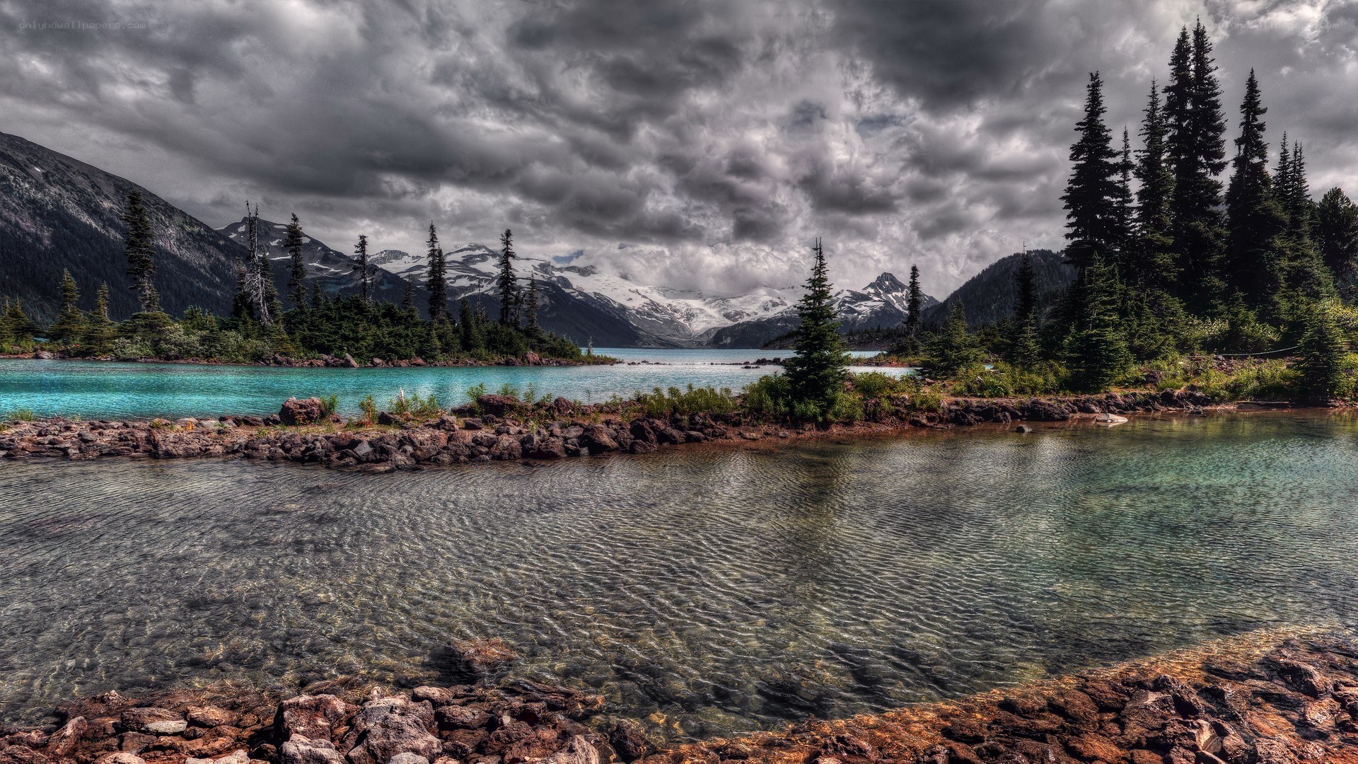 Mountain lake under stormy sky