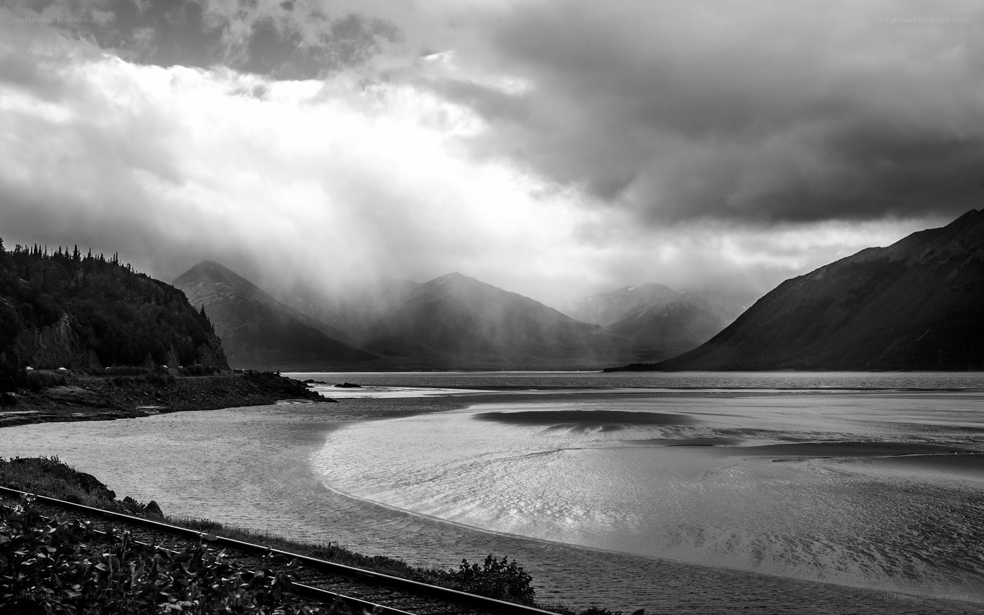 Mountain lake under stormy sky