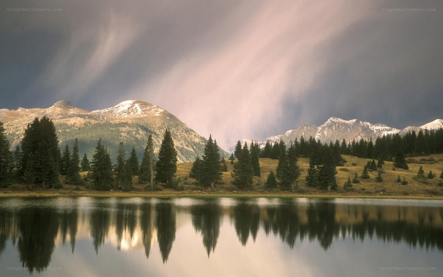 Mountain lake under stormy sky