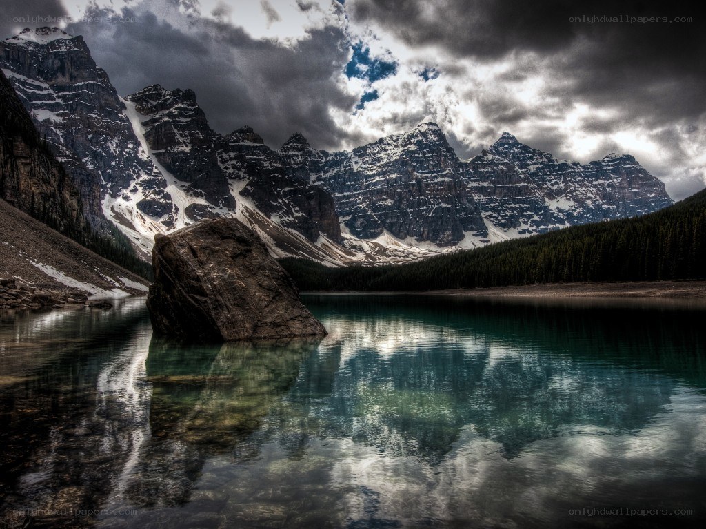 Mountain lake under stormy sky