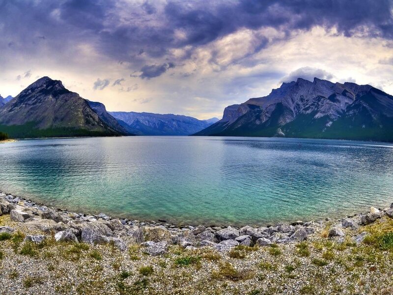 Mountain lake under stormy sky