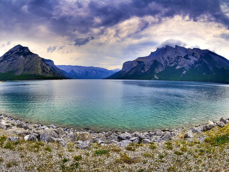 Mountain lake under stormy sky