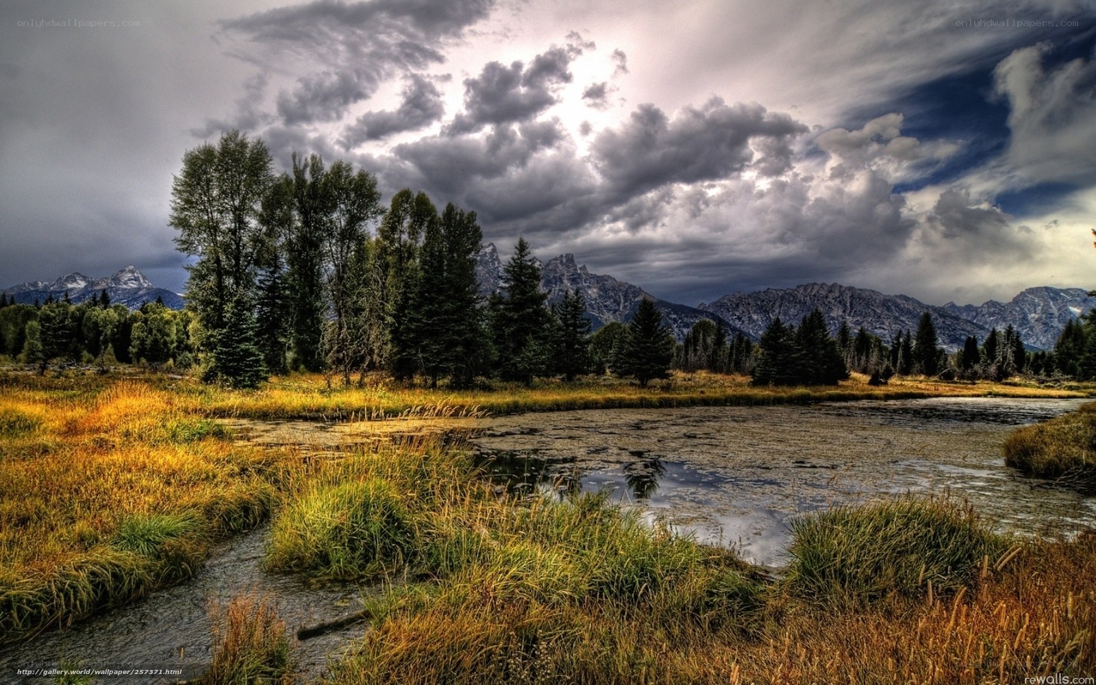 Mountain lake under stormy sky