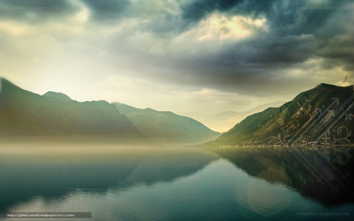 Mountain lake under stormy sky