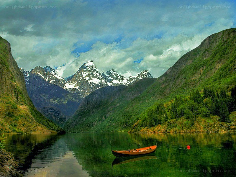Mountain lake with a boat
