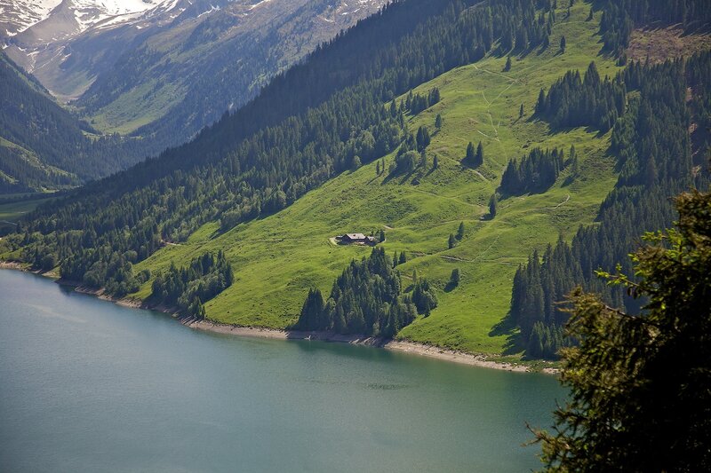 Mountain lake with alpine hut