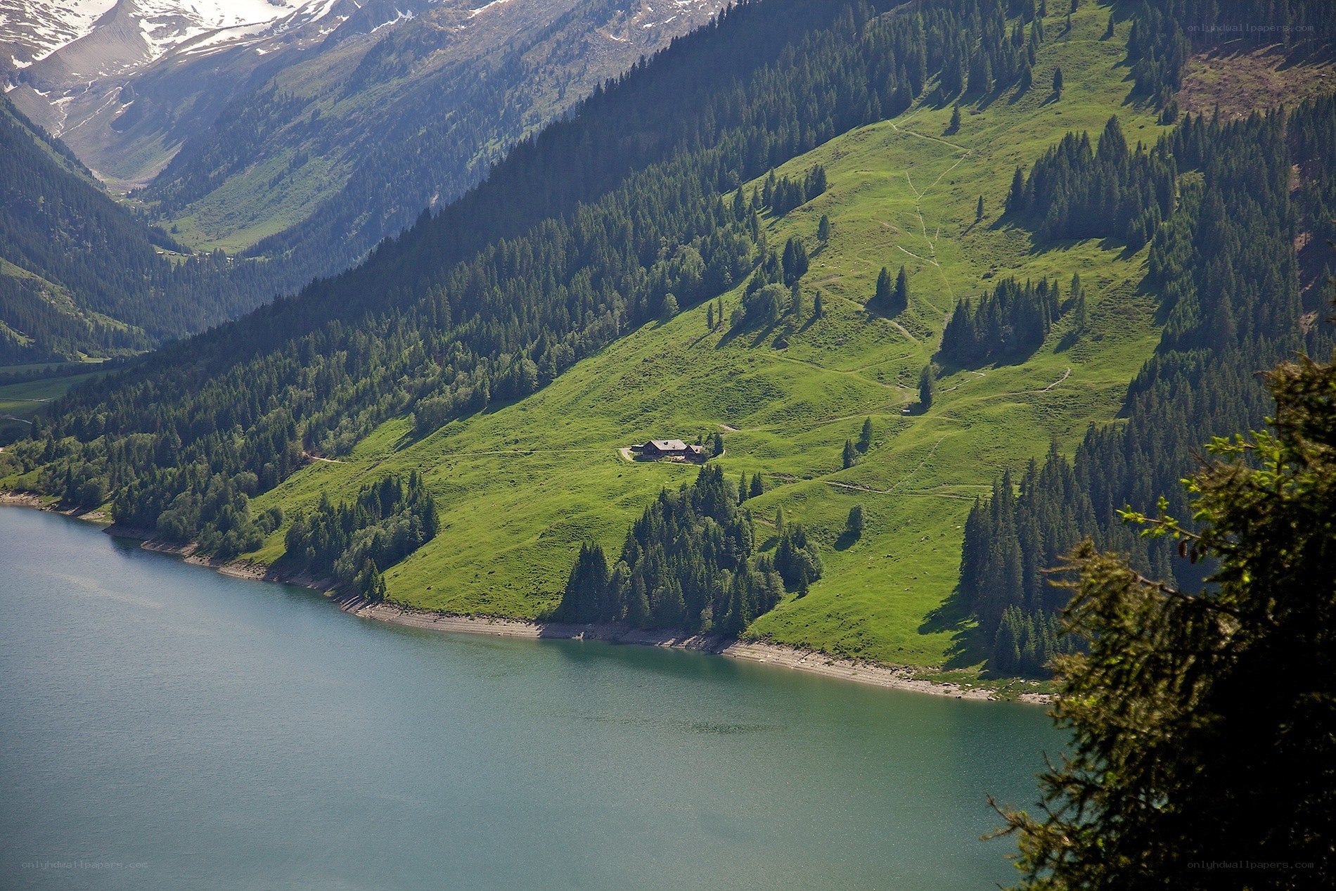 Mountain lake with alpine hut
