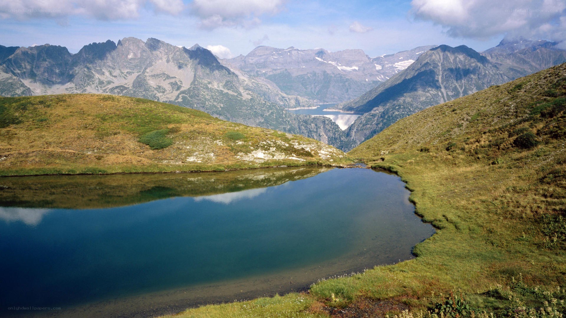 Mountain lake with alpine peaks
