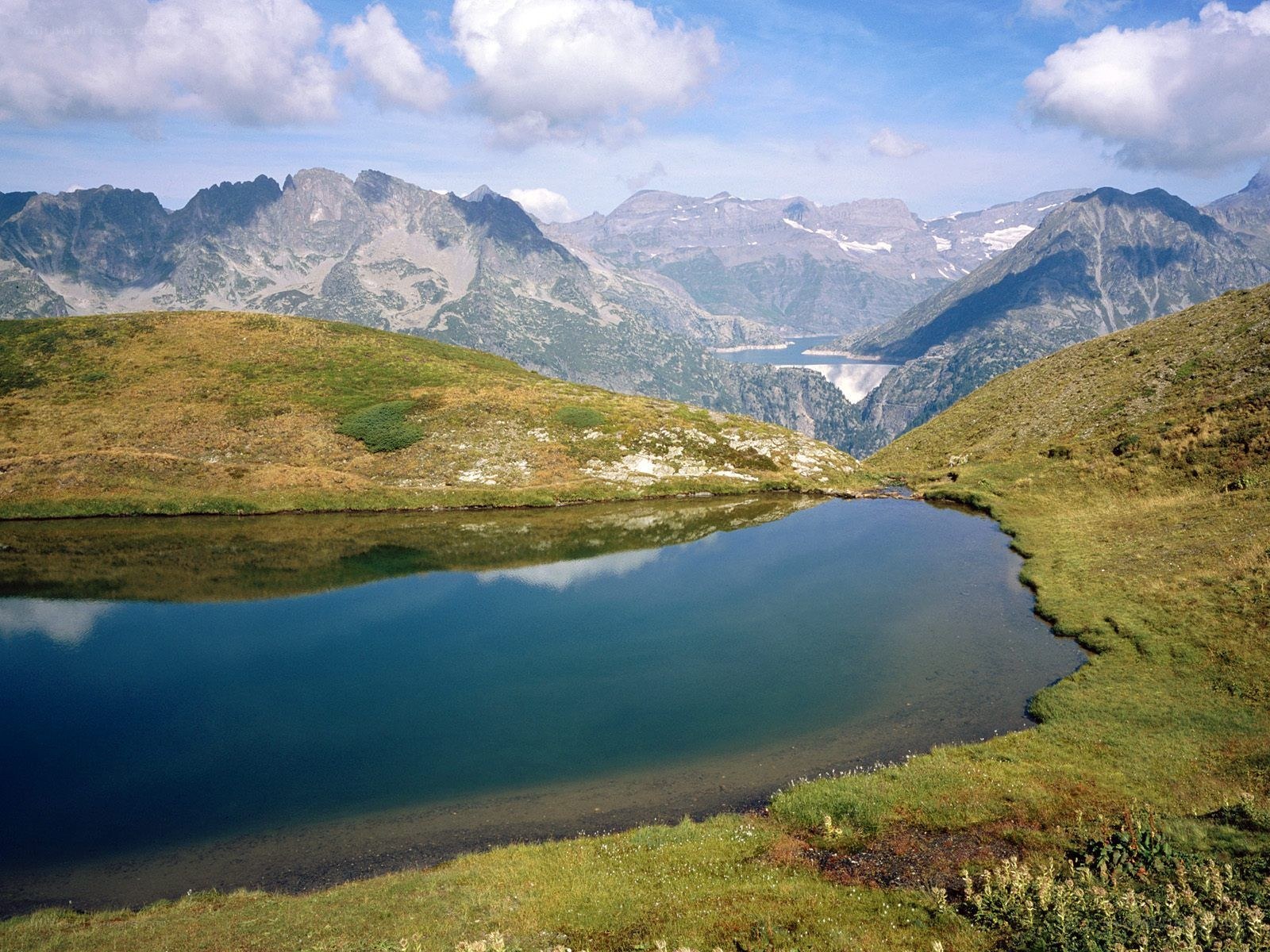 Mountain lake with alpine peaks