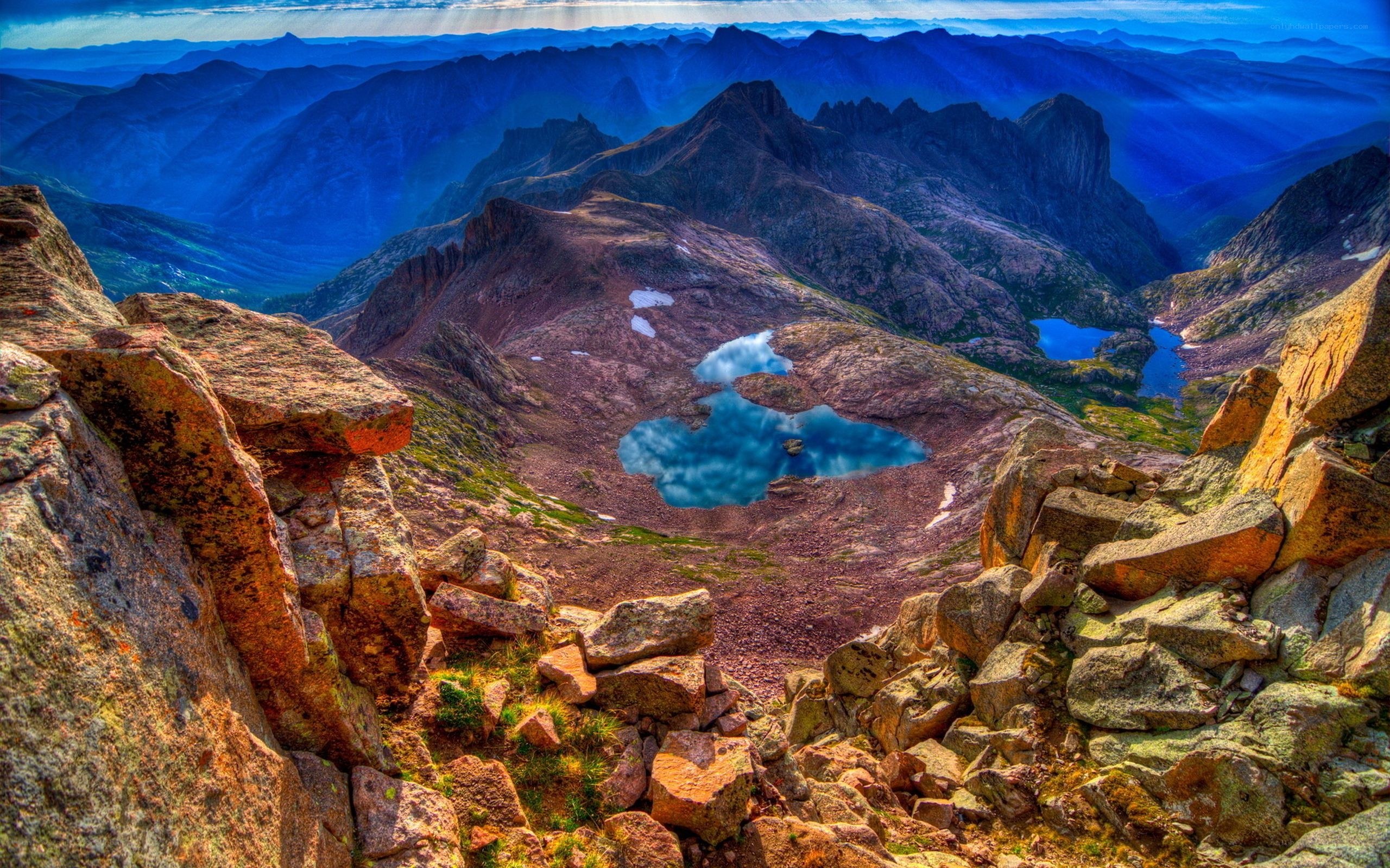 Mountain lake with blue peaks