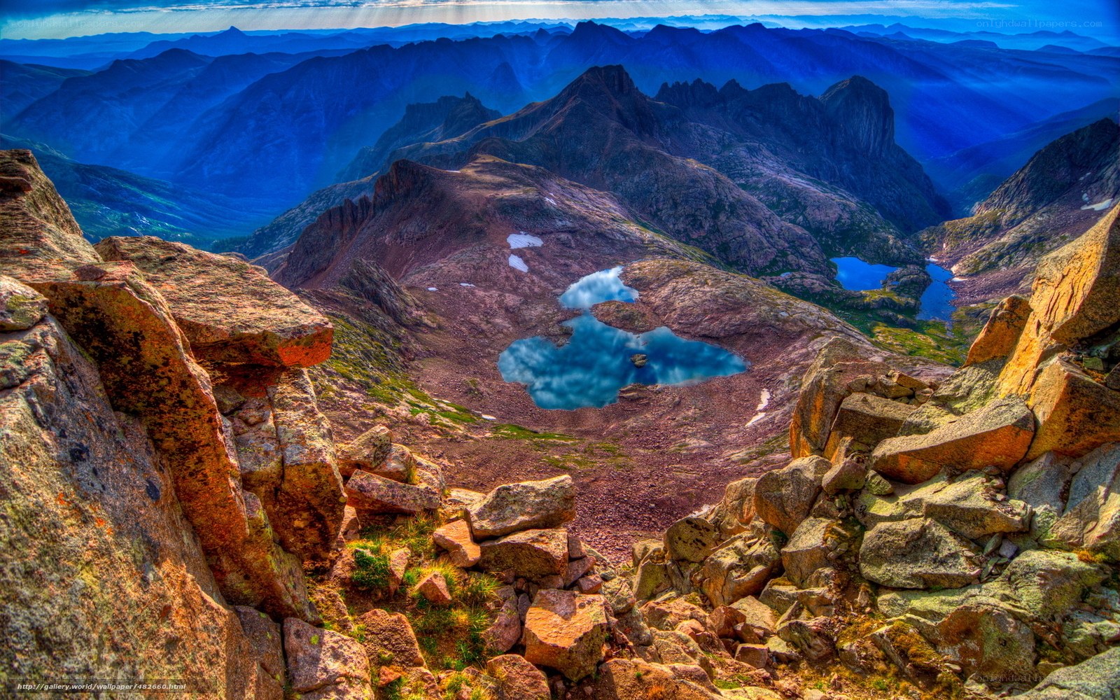 Mountain lake with blue peaks
