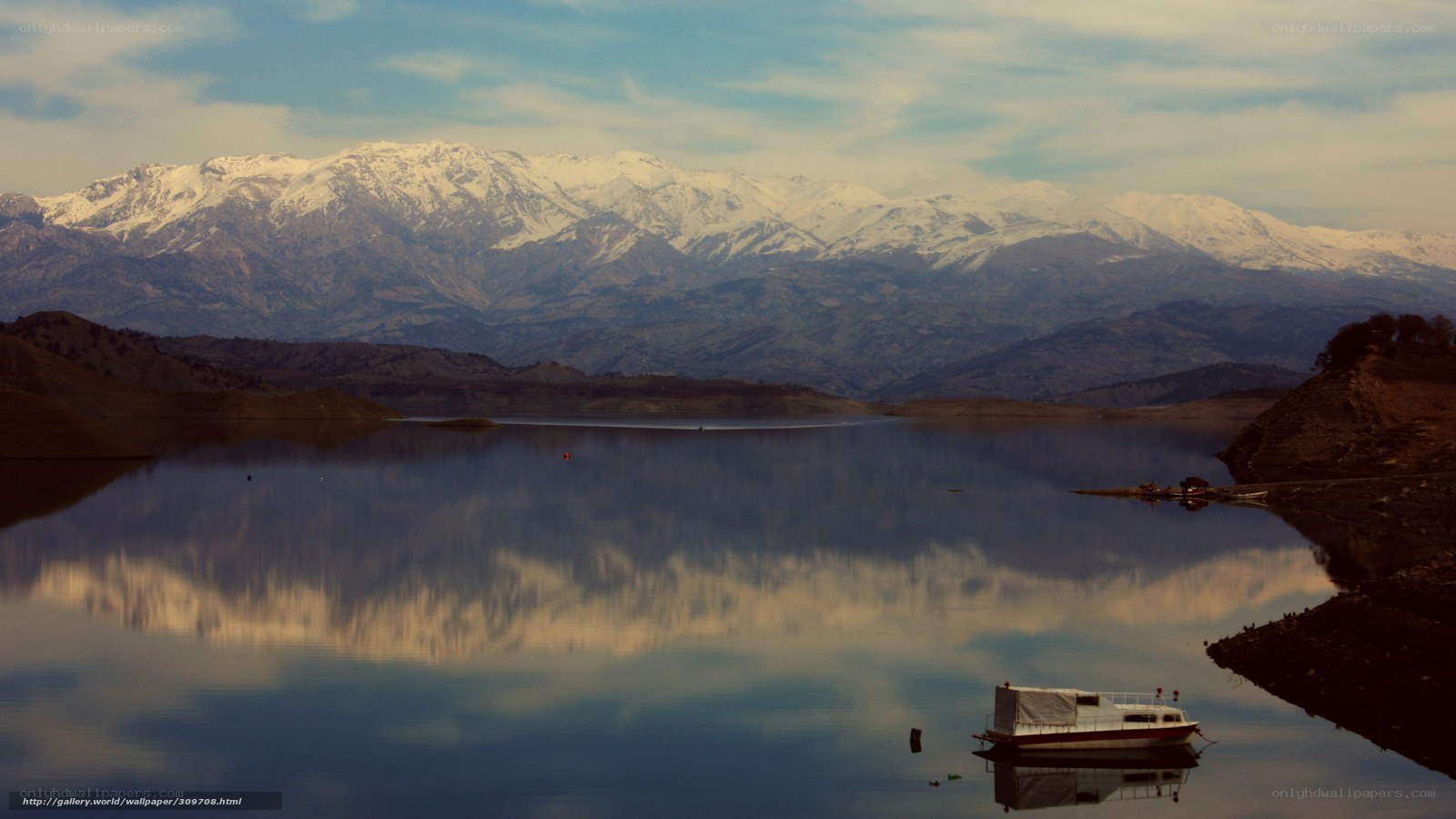Mountain lake with boat