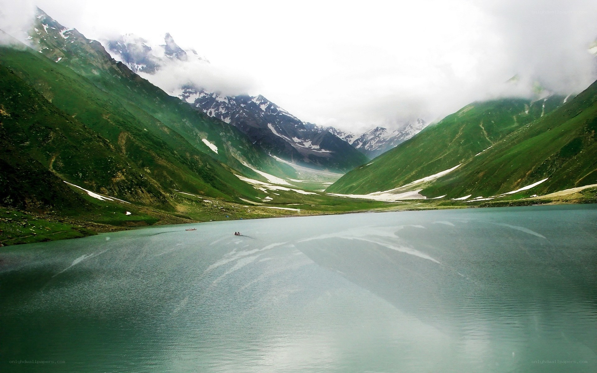 Mountain lake with boats