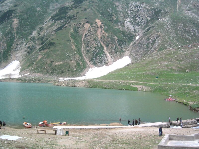mountain lake with boats