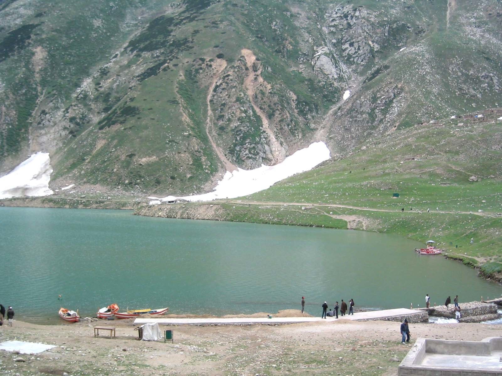 mountain lake with boats