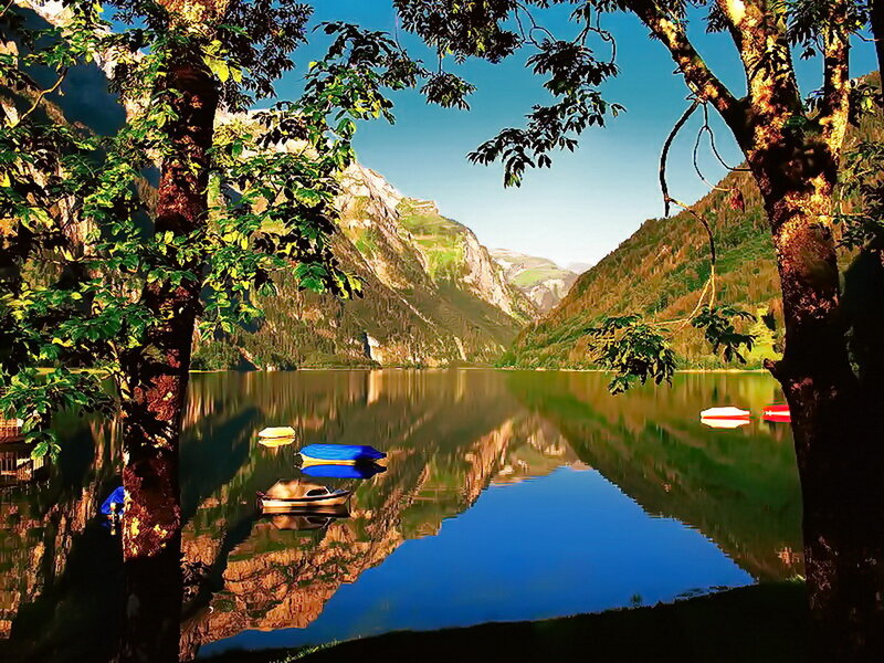 Mountain Lake with Boats — Green, Serene
