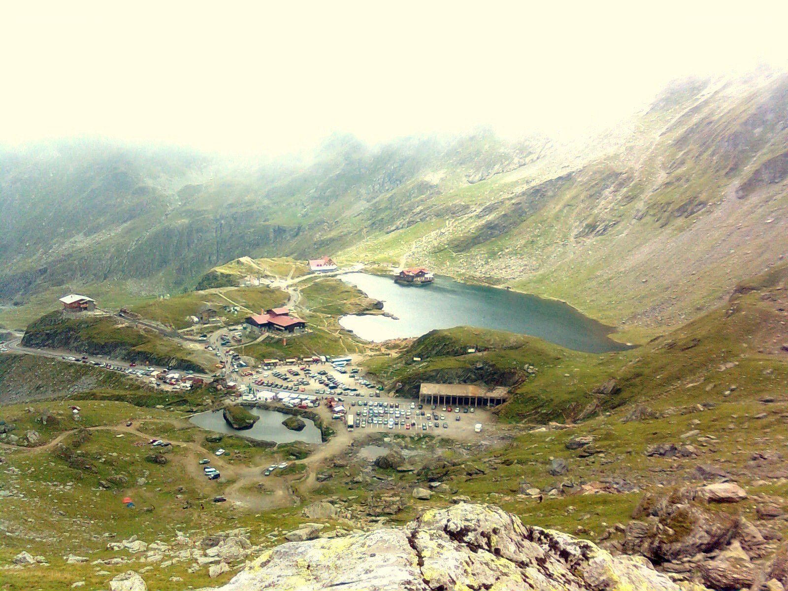 mountain lake with buildings