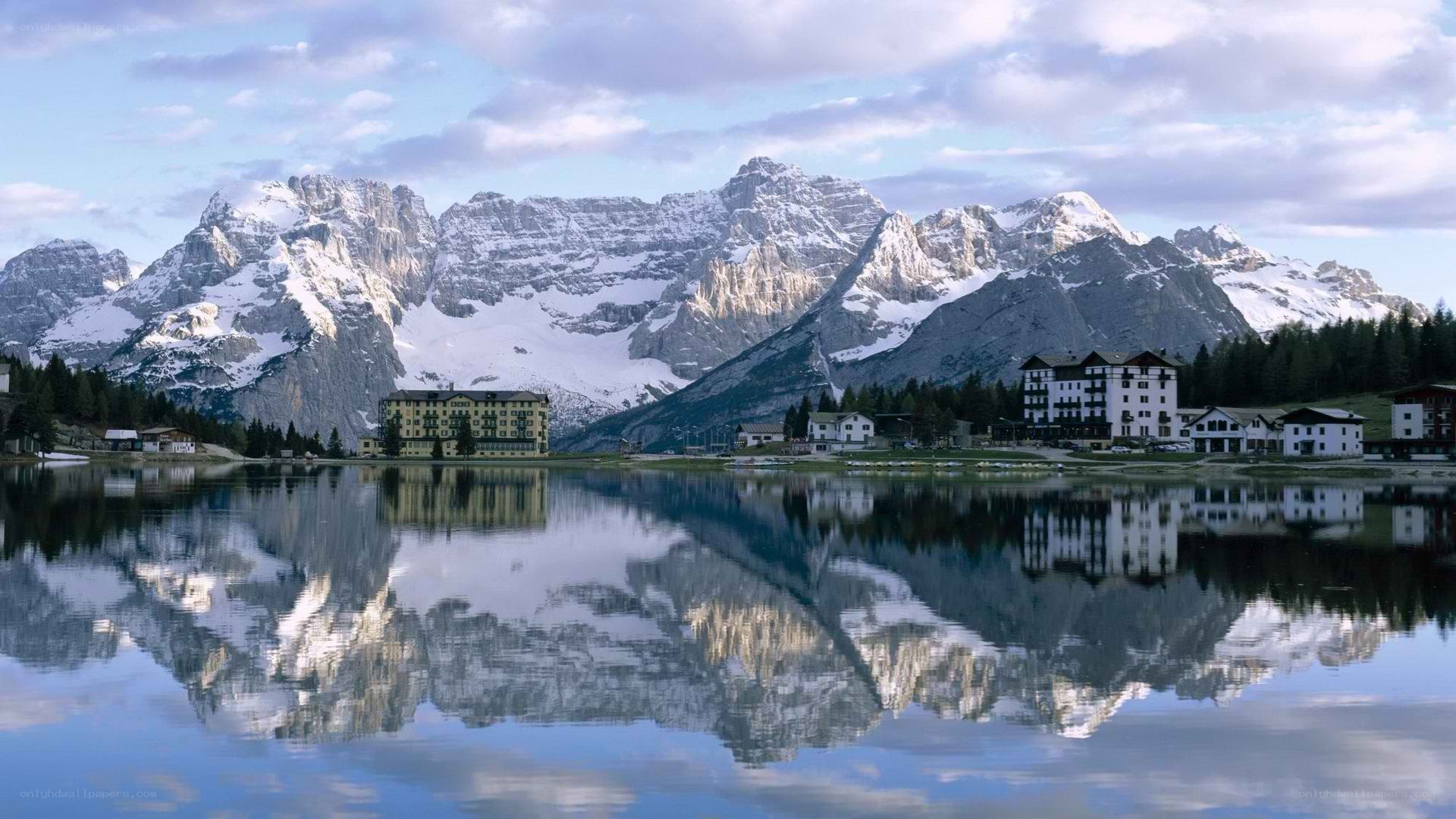 mountain lake with buildings