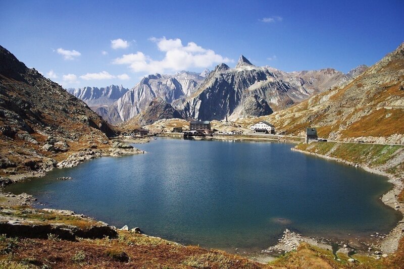 Mountain Lake with Buildings — Blue, Serene, Afternoon