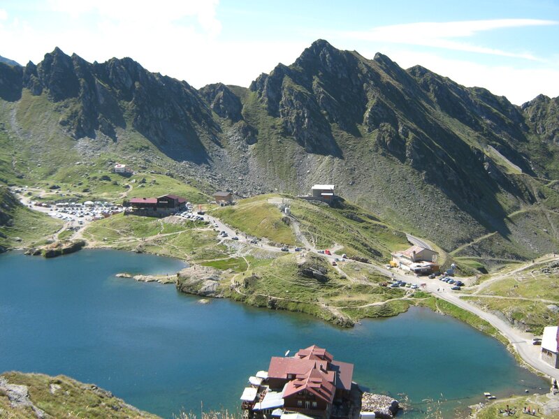 Mountain Lake with Buildings — Blue, Serene