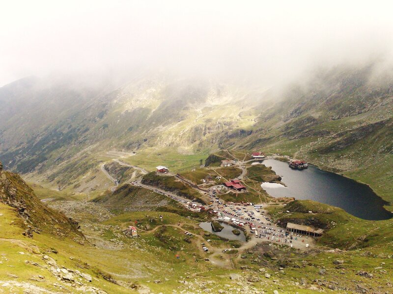 mountain lake with buildings
