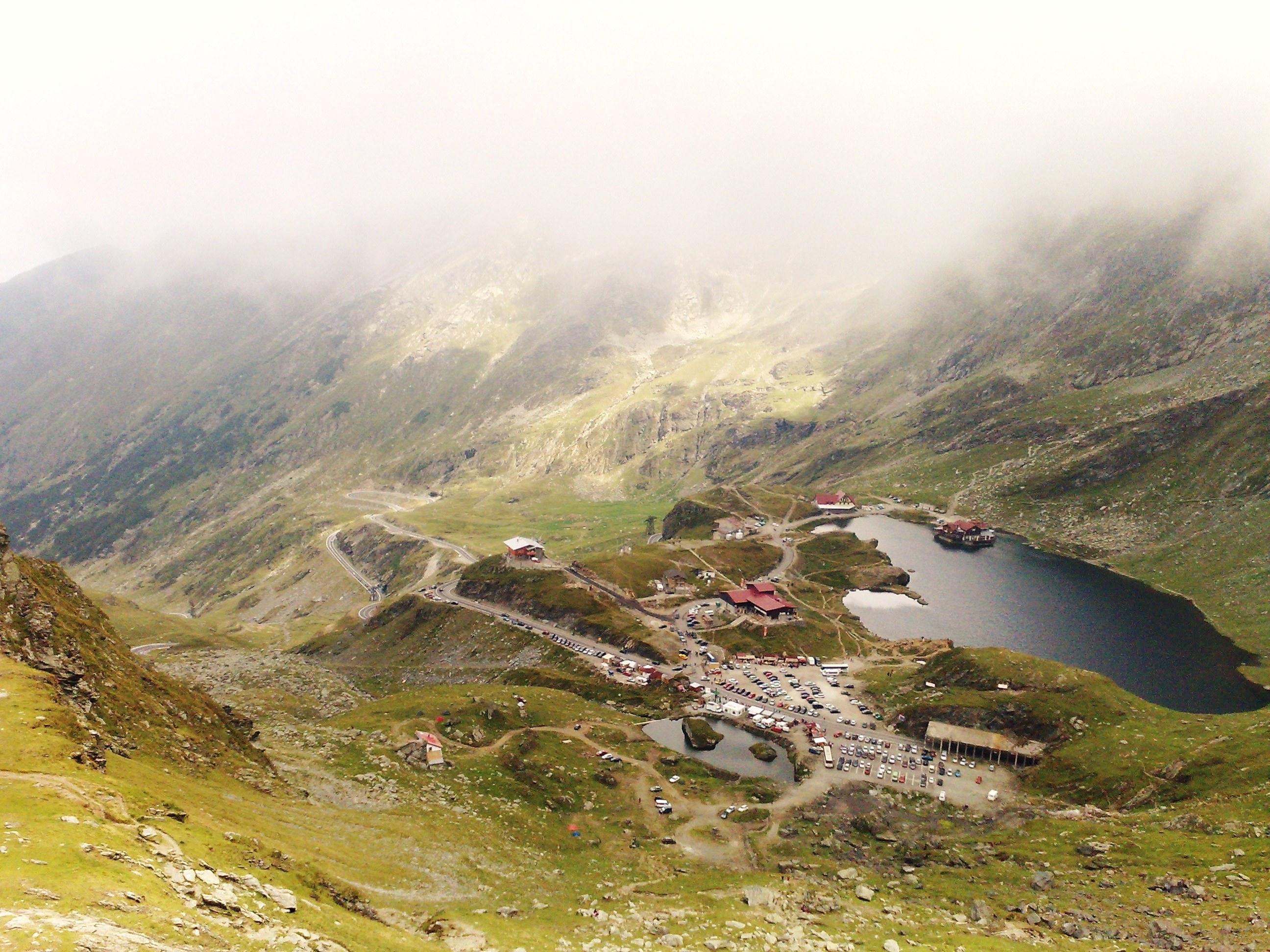 mountain lake with buildings