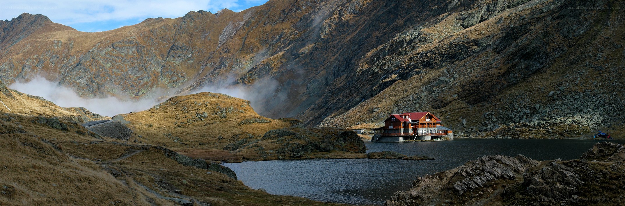 Mountain lake with cabin