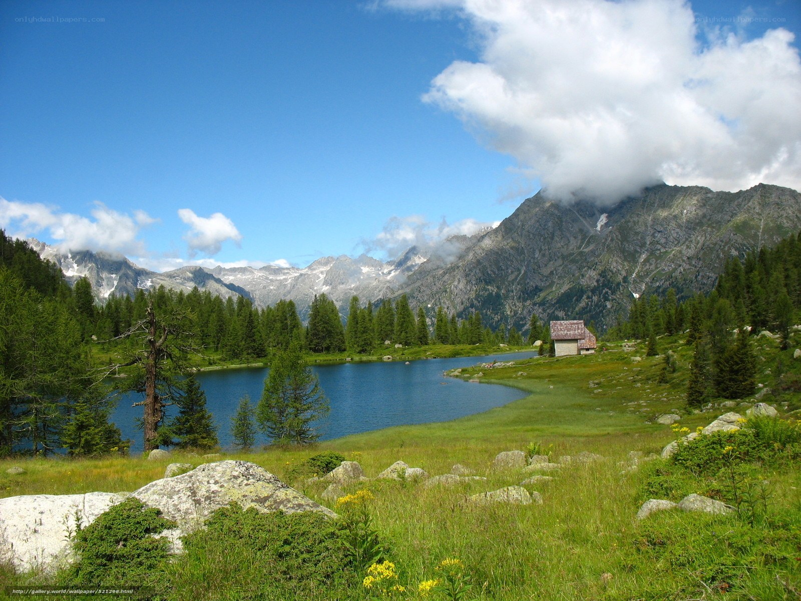 Mountain lake with cabin