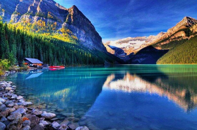 Mountain Lake with Cabin — Blue, Serene, Afternoon, Photograph, Boat