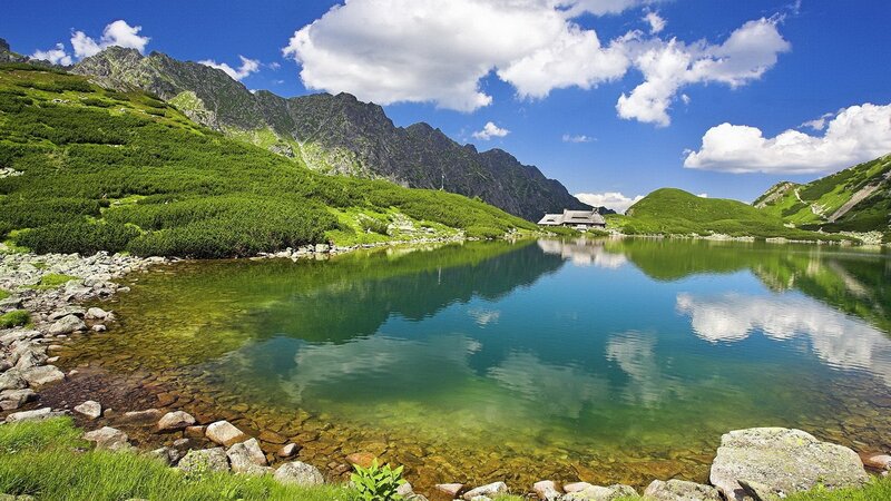 Mountain Lake with Cabin — Blue, Serene, Afternoon, Photograph, Mountains, Clouds
