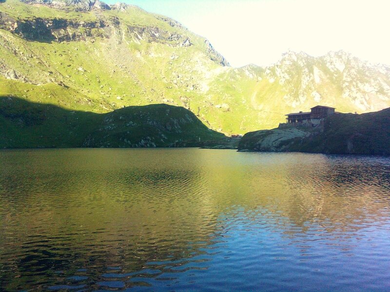 Mountain Lake with Cabin — Green, Serene, Afternoon, Photograph, Mountains