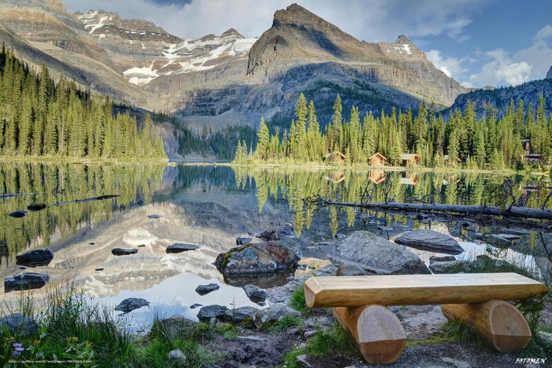 Mountain lake with cabin reflection