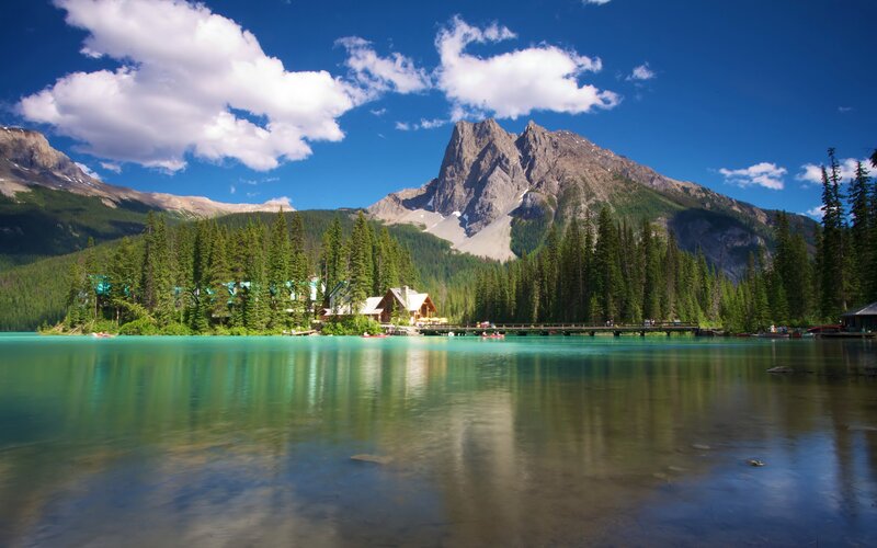 Mountain Lake with Cabins — Blue, Serene, Afternoon, Photograph, Mountains, Forest
