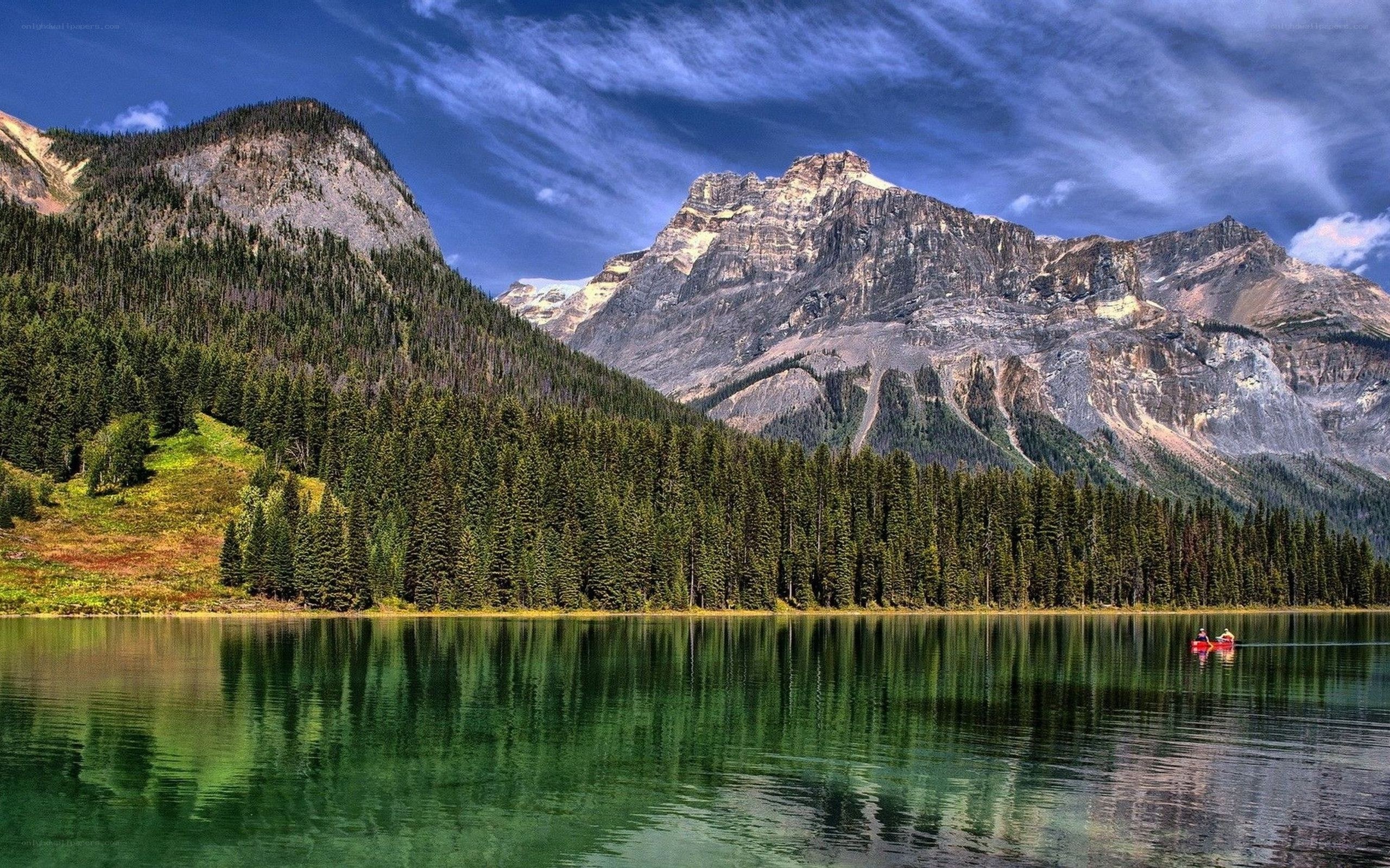 Mountain lake with canoe